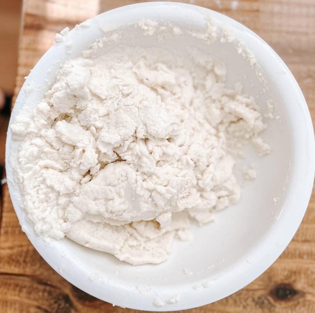 white bowl with mixed flour in it.