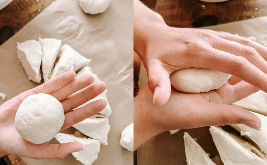 hands rolling dough into balls and forming disks.